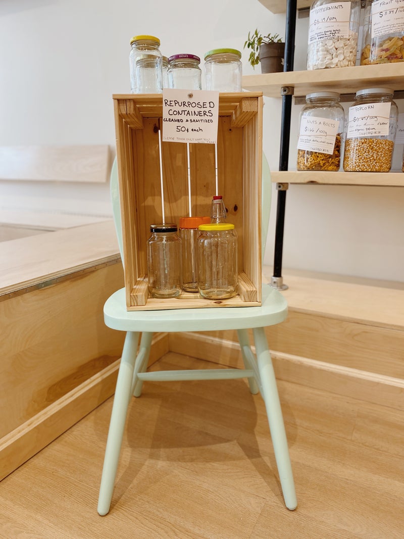 the jar library sits on a stool at the Dartmouth Tare Shop