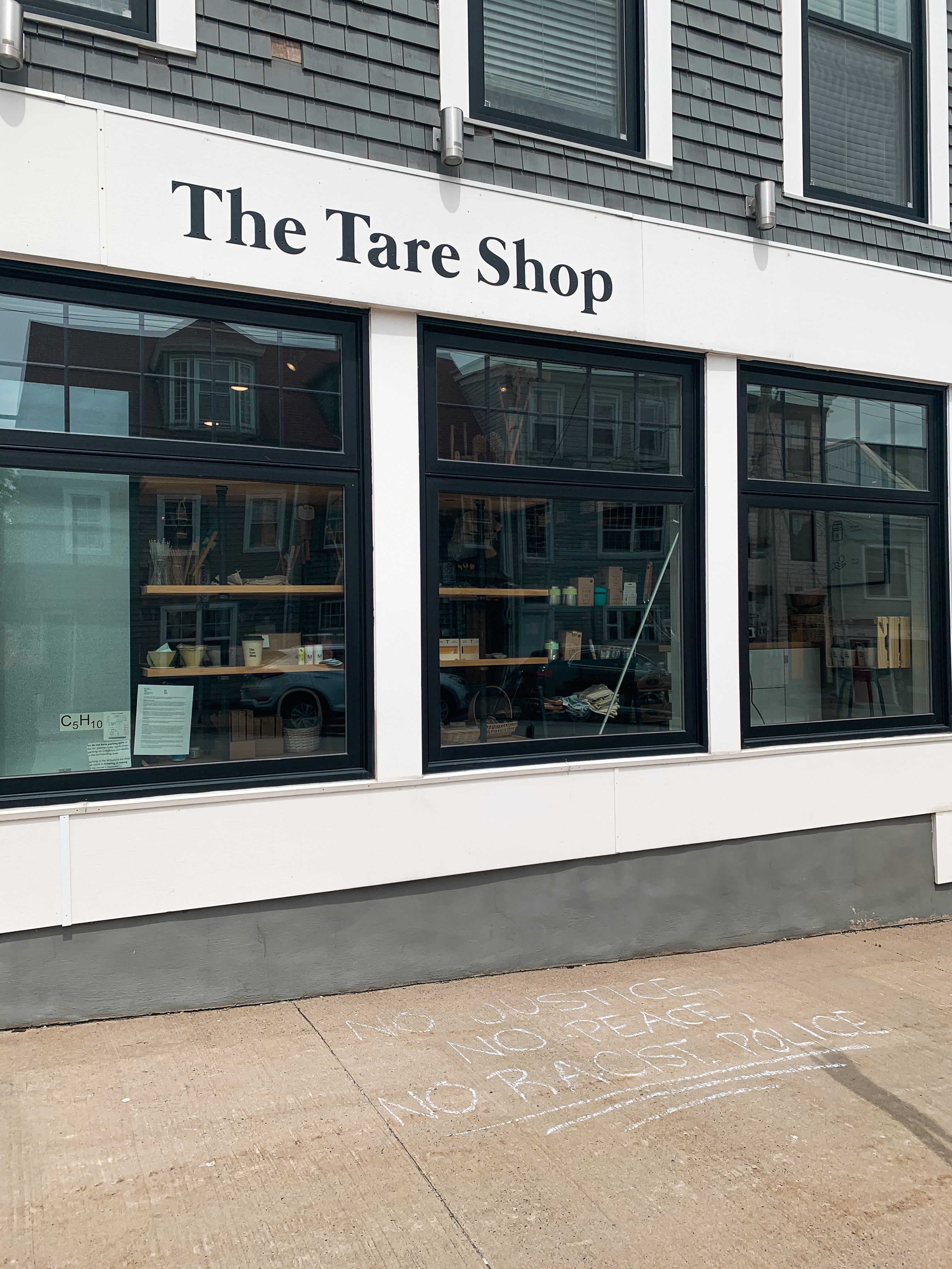 The Tare Shop sign sits in black above the windows of the Halifax store.