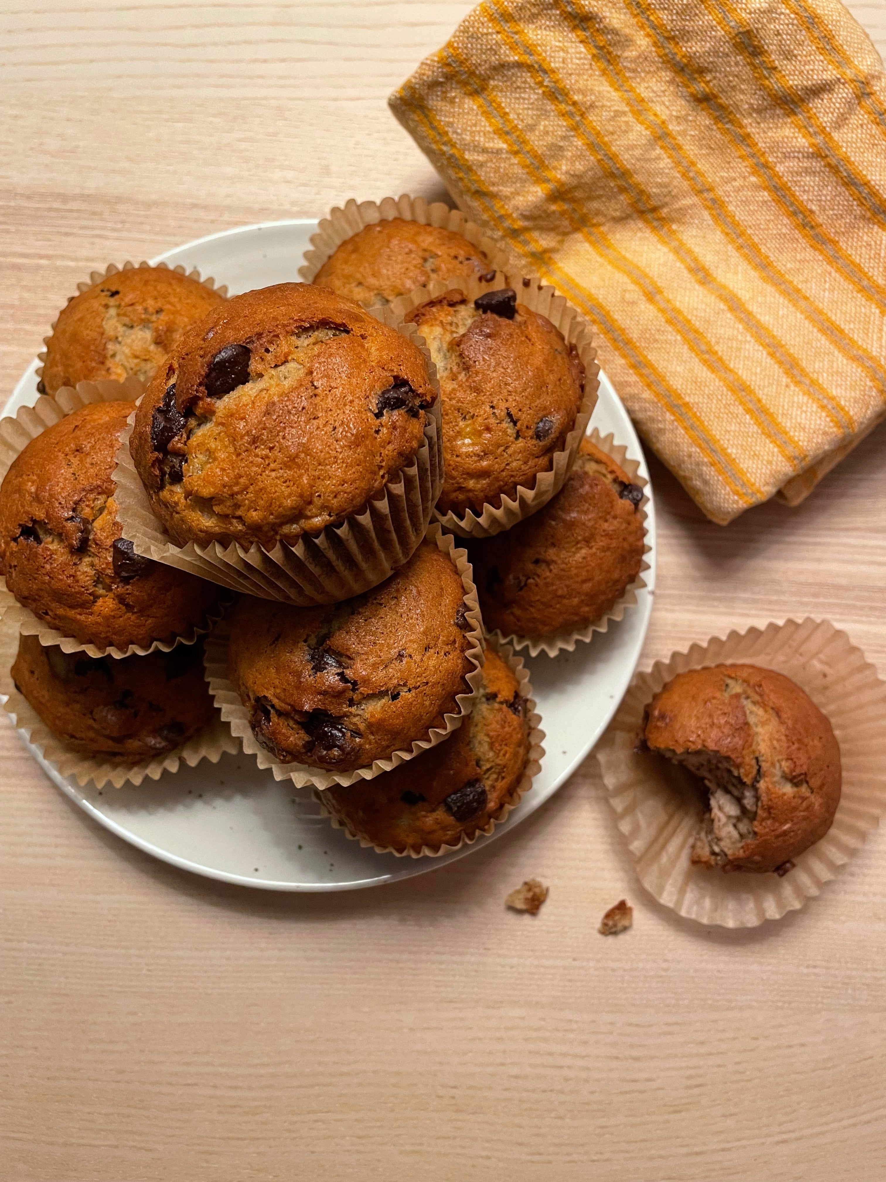 zero waste banana bread muffins sit on a white plate.